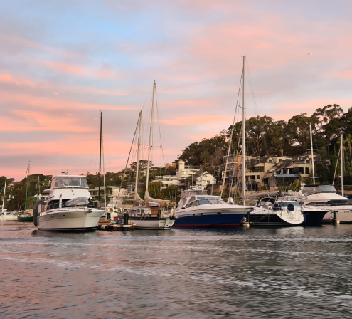 A row of boats at sunset