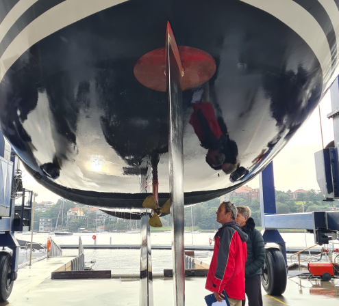 A couple inspects their boat